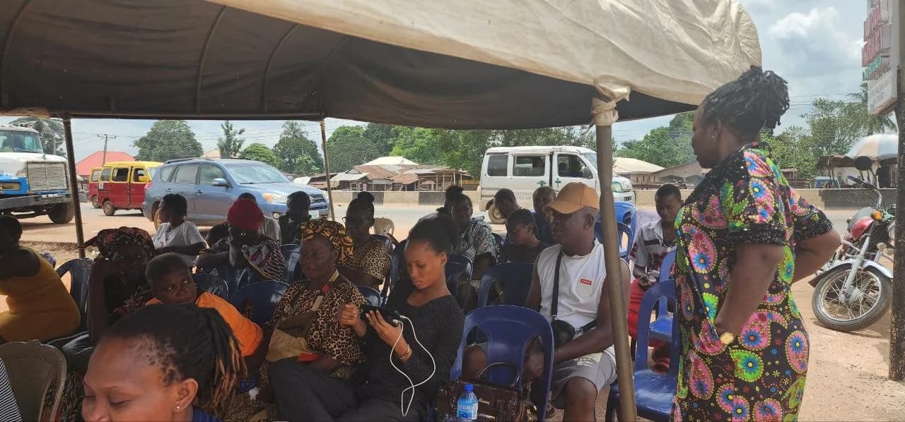 Community members seated at the outreach event